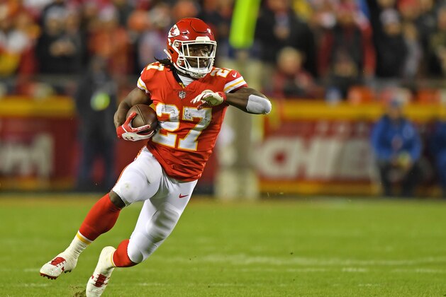 KANSAS CITY, MO - OCTOBER 30:  Running back Kareem Hunt #27 of the Kansas City Chiefs runs up field against the Denver Broncos during the first half on October 30, 2017 at Arrowhead Stadium in Kansas City, Missouri.  (Photo by Peter G. Aiken/Getty Images)