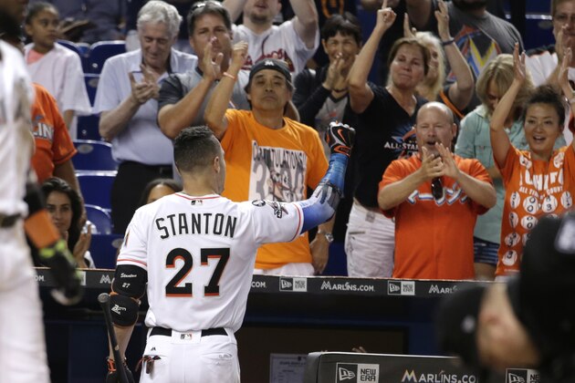 Miami Marlins' Giancarlo Stanton (27) acknowledges the crowd after he struck out swinging for his last at bat during the ninth inning of a baseball game against the Atlanta Braves, Sunday, Oct. 1, 2017, in Miami. The Braves won 8-5. Stanton finished the season with 59 home runs. (AP Photo/Lynne Sladky)