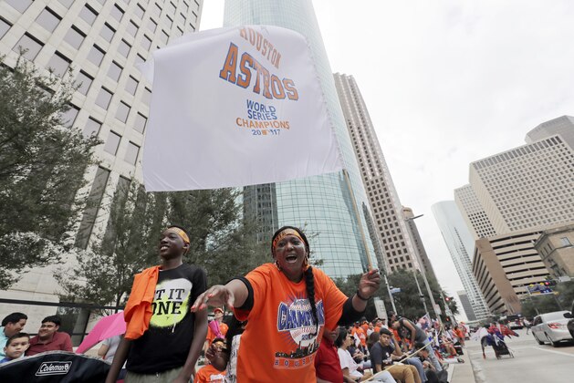 Houston Astros fans celebrate before a parade honoring the World Series baseball champions, Friday, Nov. 3, 2017, in Houston. (AP Photo/David J. Phillip)