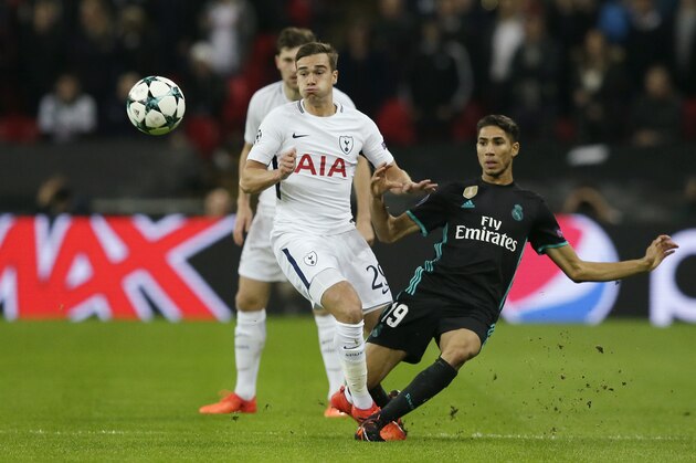 Tottenham's Harry Winks, left, challenges for the ball with Real Madrid's Achraf Hakimi during a Champions League Group H soccer match between Tottenham Hotspurs and Real Madrid at the Wembley stadium in London, Wednesday, Nov. 1, 2017. (AP Photo/Tim Ireland)