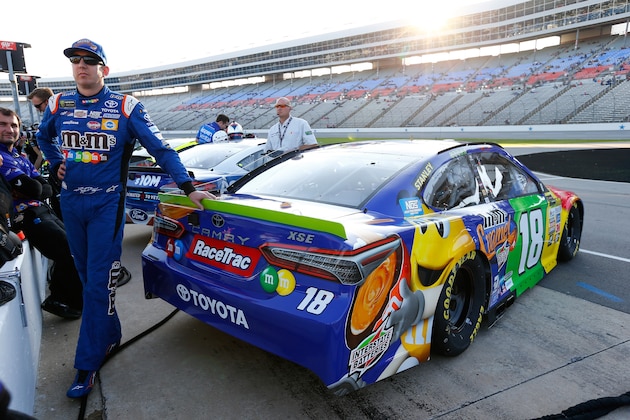 FORT WORTH, TX - NOVEMBER 03:  Kyle Busch, driver of the #18 M&M's Caramel Toyota, stands on the grid during Salute To Veterans Qualifying Days Fueled by Texas Lottery for the Monster Energy NASCAR Cup Series AAA Texas 500 at Texas Motor Speedway on November 3, 2017 in Fort Worth, Texas.  (Photo by Jonathan Ferrey/Getty Images for Texas Motor Speedway)