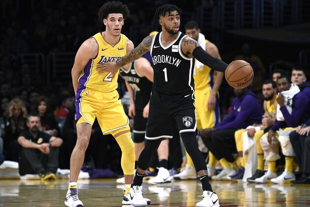 LOS ANGELES, CA - NOVEMBER 5: D'Angelo Russell #1 of the Brooklyn Nets making his first come back to Staples Center is guarded by Lonzo Ball #2 of the Los Angeles Lakers during the second half of a basketball game at Staples Center November 5 2017, in Los Angeles, California. NOTE TO USER: User expressly acknowledges and agrees that, by downloading and or using this photograph, User is consenting to the terms and conditions of the Getty Images License Agreement. (Photo by Kevork Djansezian/Getty Images)