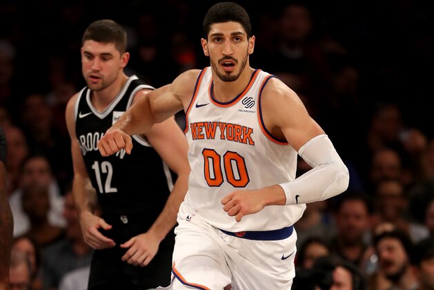 NEW YORK, NY - OCTOBER 27:  Enes Kanter #00 of the New York Knicks celebrates his basket in the second half as Joe Harris #12 of the Brooklyn Nets looks on at Madison Square Garden on October 27, 2017 in New York City. NOTE TO USER: User expressly acknowledges and agrees that, by downloading and or using this Photograph, user is consenting to the terms and conditions of the Getty Images License Agreement  (Photo by Elsa/Getty Images)