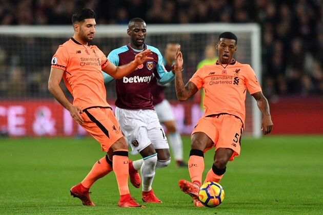 West Ham United's Spanish midfielder Pedro Obiang (C) is blocked by Liverpool's German midfielder Emre Can and Liverpool's Dutch midfielder Georginio Wijnaldum (R) during the English Premier League football match between West Ham United and Liverpool at The London Stadium, in east London on November 4, 2017. / AFP PHOTO / Ben STANSALL / RESTRICTED TO EDITORIAL USE. No use with unauthorized audio, video, data, fixture lists, club/league logos or 'live' services. Online in-match use limited to 75 images, no video emulation. No use in betting, games or single club/league/player publications.  /         (Photo credit should read BEN STANSALL/AFP/Getty Images)
