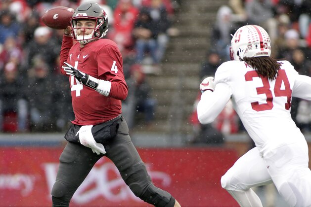 Washington State quarterback Luke Falk (4) throws a pass as he is chased by Stanford linebacker Peter Kalambayi (34) during the first half of an NCAA college football game in Pullman, Wash., Saturday, Nov. 4, 2017. (AP Photo/Young Kwak)