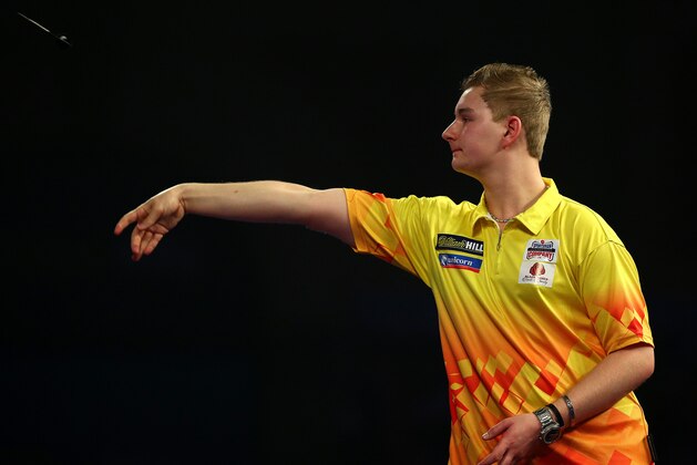 LONDON, ENGLAND - DECEMBER 27: Dimitri Van den Bergh of Holland in action during his second round match against Benito van de Pas of Holland during the 2016 William Hill PDC World Darts Championships on Day Nine at Alexandra Palace on December 27, 2015 in London, England. (Photo by Charlie Crowhurst/Getty Images)