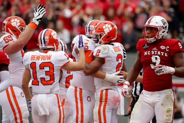 RALEIGH, NC - NOVEMBER 04:  Bradley Chubb #9 of the North Carolina State Wolfpack watches as Kelly Bryant #2 of the Clemson Tigers celebrates with teammates after scoring a touchdown during their game at Carter Finley Stadium on November 4, 2017 in Raleigh, North Carolina.  (Photo by Streeter Lecka/Getty Images)