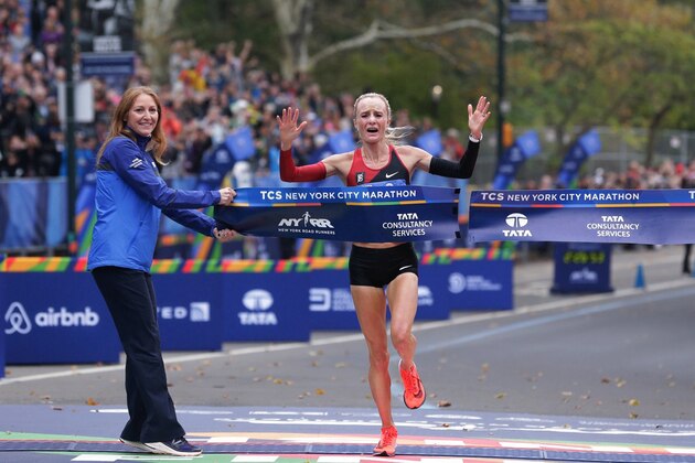 Shalane Flanagan crosses the finish line first in the women's division of the New York City Marathon in New York, Sunday, Nov. 5, 2017. (AP Photo/Seth Wenig)