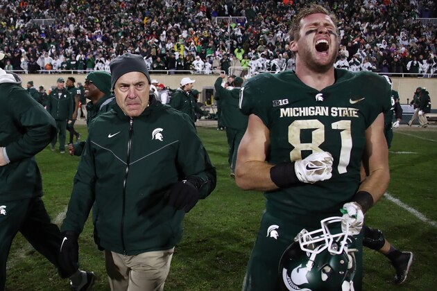 EAST LANSING, MI - NOVEMBER 04: Matt Sokol #81 of the Michigan State Spartans celebrates a 27-24 win over the Penn State Nittany Lions next to head coach Mark Dantonio at Spartan Stadium on November 4, 2017 in East Lansing, Michigan. (Photo by Gregory Shamus/Getty Images)