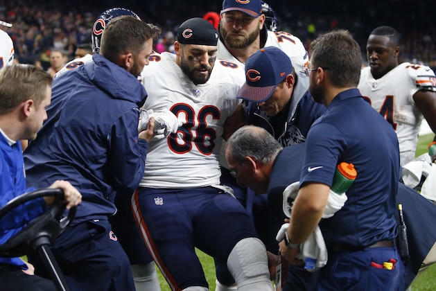 Chicago Bears tight end Zach Miller (86) is placed on a cart after injuring his leg in the second half of an NFL football game against the New Orleans Saints in New Orleans, Sunday, Oct. 29, 2017. Miller hurt his leg on an apparent touchdown reception that was overturned on review. (AP Photo/Butch Dill)