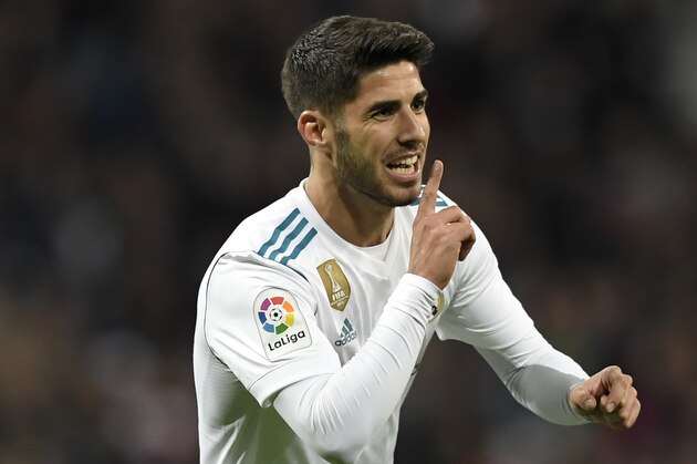 Real Madrid's Spanish midfielder Marco Asensio celebrates after scoring a goal during the Spanish league football match Real Madrid CF vs UD Las Palmas at the Santiago Bernabeu stadium in Madrid on November 5, 2017. / AFP PHOTO / GABRIEL BOUYS        (Photo credit should read GABRIEL BOUYS/AFP/Getty Images)