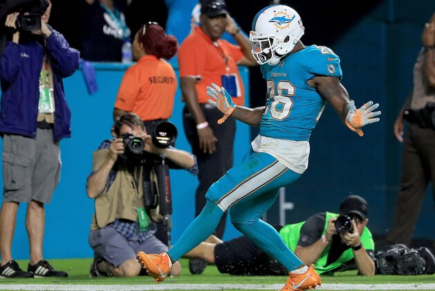 MIAMI GARDENS, FL - NOVEMBER 05: Damien Williams #26 of the Miami Dolphins scores a touchdown during a game against the Oakland Raiders at Hard Rock Stadium on November 5, 2017 in Miami Gardens, Florida.  (Photo by Mike Ehrmann/Getty Images)