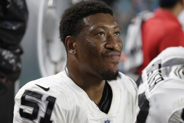 Oakland Raiders outside linebacker Bruce Irvin (51) looks up from the sidelines, during the second half of an NFL football game against the Miami Dolphins, Sunday, Nov. 5, 2017, in Miami Gardens, Fla. (AP Photo/Lynne Sladky)