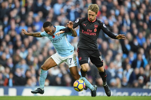 MANCHESTER, ENGLAND - NOVEMBER 05:  Nacho Monreal of Arsenal fouls Raheem Sterling of Manchester City and a penalty is awarded during the Premier League match between Manchester City and Arsenal at Etihad Stadium on November 5, 2017 in Manchester, England.  (Photo by Laurence Griffiths/Getty Images)