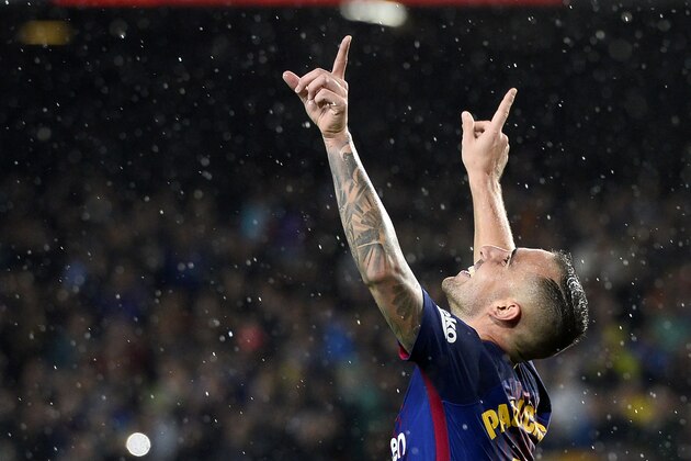 TOPSHOT - Barcelona's Spanish forward Paco Alcacer celebrates after scoring a goal during the Spanish league football match FC Barcelona vs Sevilla FC at the Camp Nou stadium in Barcelona on November 4, 2017. / AFP PHOTO / Josep LAGO        (Photo credit should read JOSEP LAGO/AFP/Getty Images)