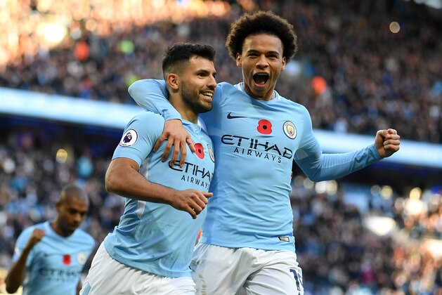 MANCHESTER, ENGLAND - NOVEMBER 05: Sergio Aguero of Manchester City celebrates scoring his sides second goal with Leroy Sane of Manchester City during the Premier League match between Manchester City and Arsenal at Etihad Stadium on November 5, 2017 in Manchester, England.  (Photo by Laurence Griffiths/Getty Images)