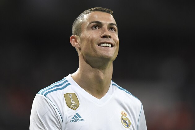 Real Madrid's Portuguese forward Cristiano Ronaldo smiles during the Spanish league football match Real Madrid CF vs UD Las Palmas at the Santiago Bernabeu stadium in Madrid on November 5, 2017. / AFP PHOTO / GABRIEL BOUYS        (Photo credit should read GABRIEL BOUYS/AFP/Getty Images)