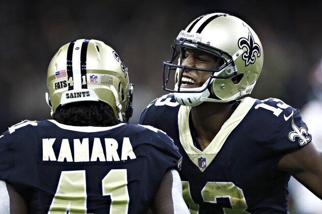 NEW ORLEANS, LA - OCTOBER 29:  Alvin Kamara #41 and Michael Thomas #13 of the New Orleans Saints celebrate after a big catch by Kamara during a game against the Chicago Bears at Mercedes-Benz Superdome on October 29, 2017 in New Orleans, Louisiana.  The Saints defeated the Bears 20-12.  (Photo by Wesley Hitt/Getty Images)
