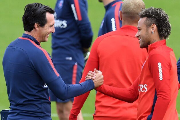 Paris Saint-Germain's Brazilian forward Neymar (R) shakes hands with Paris Saint-Germain's Spanish head coach Unai Emery (L) during a training session at the Camp des Loges in Saint-Germain-en-Laye, near Paris, on August 11, 2017.  / AFP PHOTO / ALAIN JOCARD        (Photo credit should read ALAIN JOCARD/AFP/Getty Images)