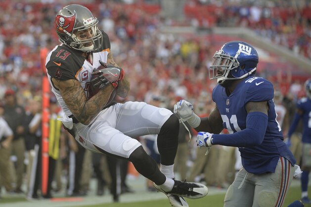 Tampa Bay Buccaneers wide receiver Mike Evans (13) is hit by New York Giants strong safety Landon Collins (21) after a reception during the second quarter of an NFL football game Sunday, Oct. 1, 2017, in Tampa, Fla. (AP Photo/Phelan Ebenhack) Tampa Bay Buccaneers wide receiver Mike Evans (13) is hit by New York Giants strong safety Landon Collins (21) after a reception during the second quarter of an NFL football game Sunday, Oct. 1, 2017, in Tampa, Fla. (AP Photo/Phelan Ebenhack)