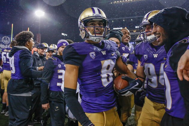 SEATTLE, WA - NOVEMBER 04:  Punt returner Dante Pettis #8 of the Washington Huskies is congratulated by teammates after returning a punt for a touchdown against the Oregon Ducks at Husky Stadium on November 4, 2017 in Seattle, Washington. The return for a touchdown was the ninth in Pettis' college career, setting an NCAA Division I record.  (Photo by Otto Greule Jr/Getty Images)