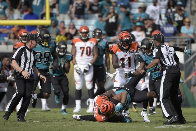 Cincinnati Bengals wide receiver A.J. Green (18) takes down Jacksonville Jaguars cornerback Jalen Ramsey (20) during a fight in the first half of an NFL football game Sunday, Nov. 5, 2017, in Jacksonville, Fla. (AP Photo/Phelan M. Ebenhack)