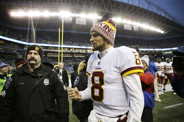 Washington Redskins quarterback Kirk Cousins (8) pumps his fist as he walks off the field after an NFL football game against the Seattle Seahawks, Sunday, Nov. 5, 2017, in Seattle. (AP Photo/Stephen Brashear)