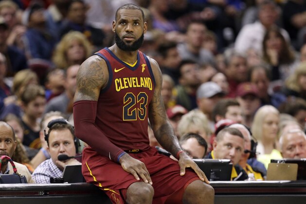 Cleveland Cavaliers' LeBron James waits to reenter the game in the second half of an NBA basketball game against the Atlanta Hawks, Sunday, Nov. 5, 2017, in Cleveland. (AP Photo/Tony Dejak)