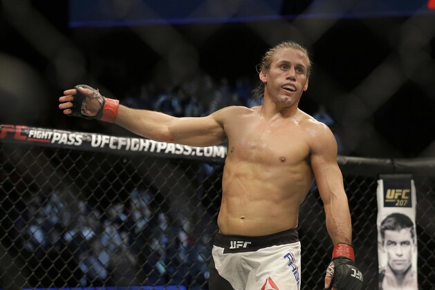 Urijah Faber reacts after beating Brad Pickett during a UFC Fight Night mixed martial arts fight in Sacramento, Calif., Saturday, Dec. 17, 2016. (AP Photo/Jeff Chiu)