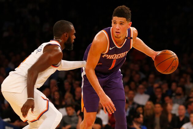 NEW YORK, NY - NOVEMBER 03:  (NEW YORK DAILIES OUT)   Devin Booker #1 of the Phoenix Suns in action against Tim Hardaway Jr. #3 of the New York Knicks at Madison Square Garden on November 3, 2017 in New York City. The Knicks defeated the Suns 120-107. NOTE TO USER: User expressly acknowledges and agrees that, by downloading and/or using this Photograph, user is consenting to the terms and conditions of the Getty Images License Agreement.  (Photo by Jim McIsaac/Getty Images)