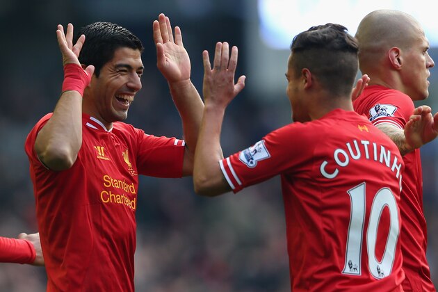 LIVERPOOL, ENGLAND - NOVEMBER 23:  Luis Suarez of Liverpool celebrates scoring his team's second goal with team-mate Coutinho during the Barclays Premier League match between Everton and Liverpool at Goodison Park on November 23, 2013 in Liverpool, England.  (Photo by Alex Livesey/Getty Images)