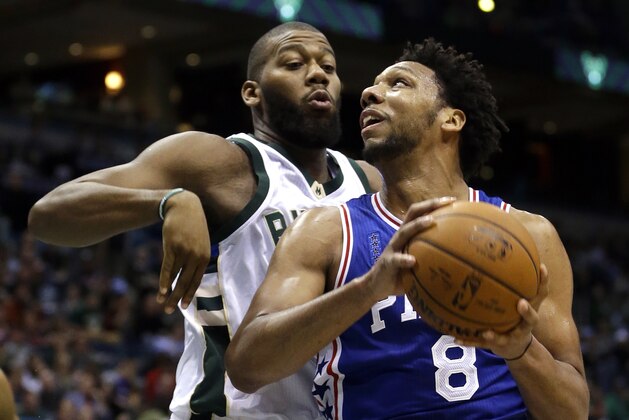 Philadelphia 76ers' Jahlil Okafor (8) looks to shoot against Milwaukee Bucks' Greg Monroe during an NBA basketball game Wednesday, Dec. 23, 2015, in Milwaukee. (AP Photo/Aaron Gash)