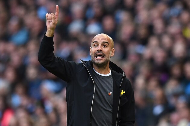 Manchester City's Spanish manager Pep Guardiola gestures on the touchline during the English Premier League football match between Manchester City and Arsenal at the Etihad Stadium in Manchester, north west England, on November 5, 2017. / AFP PHOTO / Oli SCARFF / RESTRICTED TO EDITORIAL USE. No use with unauthorized audio, video, data, fixture lists, club/league logos or 'live' services. Online in-match use limited to 75 images, no video emulation. No use in betting, games or single club/league/player publications.  /         (Photo credit should read OLI SCARFF/AFP/Getty Images)