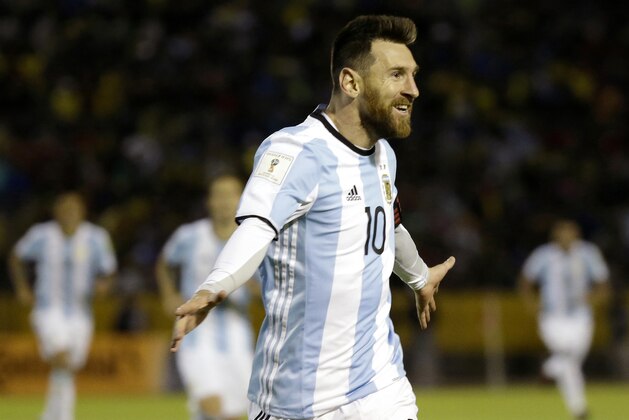 In this Tuesday, Oct. 10, 2017 photo, Argentina's Lionel Messi celebrates after scoring his third goal against Ecuador during their 2018 World Cup qualifying soccer match at the Atahualpa Olympic Stadium in Quito, Ecuador. Messi’s three goals lifted Argentina into the World Cup on the last day of South American qualifying, keeping the Argentines from missing out for the first time since 1970. (AP Photo/Fernando Vergara)