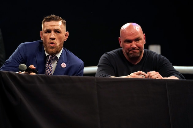 LONDON, ENGLAND - JULY 14:  (L-R) Conor McGregor interacts with the media as UFC President Dana White listens on stage during the Floyd Mayweather Jr. v Conor McGregor World Press Tour event at SSE Arena on July 14, 2017 in London, England. (Photo by Jeff Bottari/Zuffa LLC/Zuffa LLC via Getty Images)
