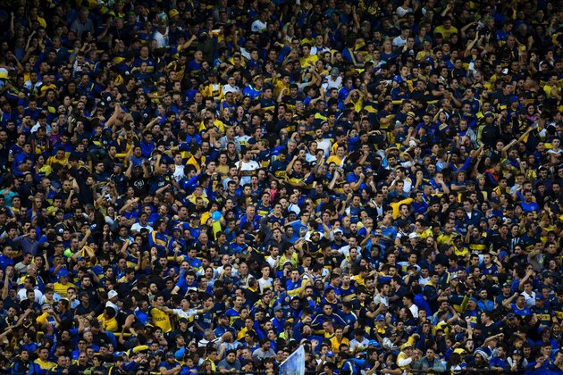 Boca Juniors' supporters cheer for their team during the Argentina first division football match against River Plate at the La Bombonera stadium in Buenos Aires, on May 14, 2017. / AFP PHOTO / Eitan ABRAMOVICH        (Photo credit should read EITAN ABRAMOVICH/AFP/Getty Images)