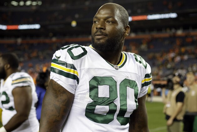 FILE - In this Aug. 26, 2017, file photo, Green Bay Packers tight end Martellus Bennett (80) smiles after an NFL preseason football game against the Denver Broncos, in Denver. Bennett always has a way with words. This week's entertaining analogy from the Green Bay Packers' tight end had to do with baking cakes. (AP Photo/Jack Dempsey, File)