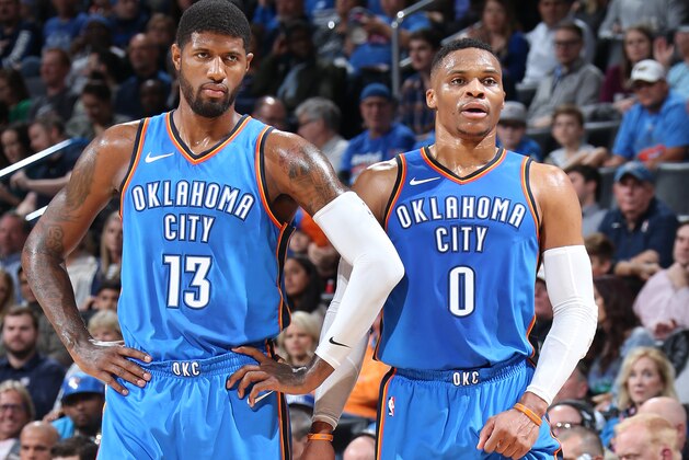 OKLAHOMA CITY, OK - NOVEMBER 3: Paul George #13 and Russell Westbrook #0 of the Oklahoma City Thunder look on during the game against the Boston Celtics on November 3, 2017 at Chesapeake Energy Arena in Oklahoma City, Oklahoma. NOTE TO USER: User expressly acknowledges and agrees that, by downloading and or using this Photograph, user is consenting to the terms and conditions of the Getty Images License Agreement. Mandatory Copyright Notice: Copyright 2017 NBAE (Photo by Layne Murdoch/NBAE via Getty Images)