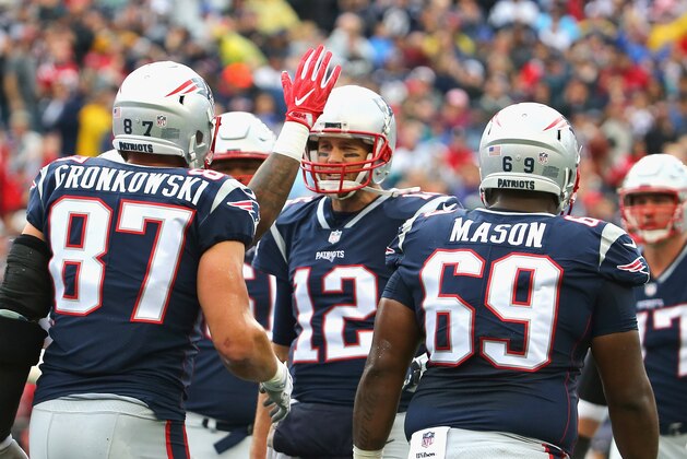 FOXBORO, MA - OCTOBER 29:  Tom Brady #12 of the New England Patriots reacts with Rob Gronkowski #87 after scoring a touchdown during the second quarter of a game against the Los Angeles Chargers at Gillette Stadium on October 29, 2017 in Foxboro, Massachusetts.  (Photo by Maddie Meyer/Getty Images)