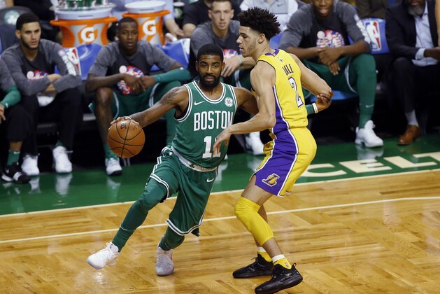 Boston Celtics' Kyrie Irving drives past Los Angeles Lakers' Lonzo Ball during the first quarter of an NBA basketball game in Boston on Wednesday, Nov. 8, 2017. (AP Photo/Winslow Townson)