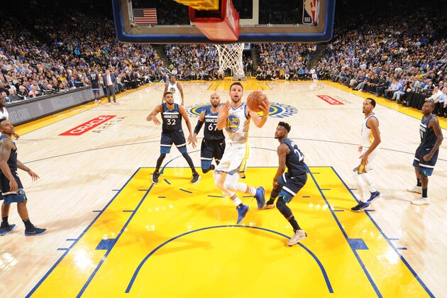 OAKLAND, CA - NOVEMBER 8: Stephen Curry #30 of the Golden State Warriors goes to the basket against the Minnesota Timberwolves on November 8, 2017 at ORACLE Arena in Oakland, California. NOTE TO USER: User expressly acknowledges and agrees that, by downloading and/or using this Photograph, user is consenting to the terms and conditions of the Getty Images License Agreement. Mandatory Copyright Notice: Copyright 2017 NBAE (Photo by Andrew D. Bernstein/NBAE via Getty Images)