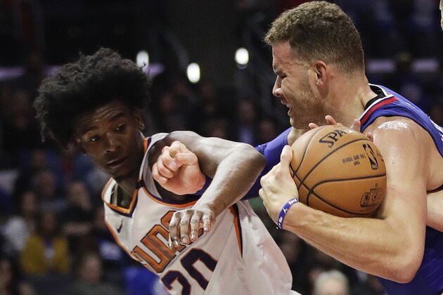 Los Angeles Clippers' Blake Griffin drives past Phoenix Suns' Josh Jackson during the second half of an NBA basketball game Sunday, Oct. 22, 2017, in Los Angeles. (AP Photo/Jae C. Hong)