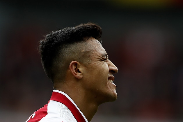 Arsenal's Alexis Sanchez grimaces during the English Premier League soccer match between Arsenal and Brighton and Hove Albion at the Emirates Stadium in London, Sunday, Oct. 1, 2017.(AP Photo/Frank Augstein)