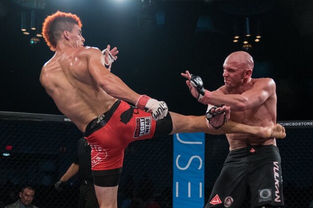 PITTSBURGH, PA - SEPTEMBER 16:  (R-L) Luke Rockhold pushes David Branch up against the cage in their middleweight bout during the UFC Fight Night event inside the PPG Paints Arena on September 16, 2017 in Pittsburgh, Pennsylvania. (Photo by Brandon Magnus/Zuffa LLC/Zuffa LLC via Getty Images)