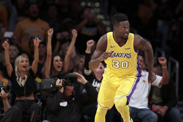 Los Angeles Lakers forward Julius Randle runs back down the court after making a shot during the second half of an NBA basketball game against the Brooklyn Nets, Friday, Nov. 3, 2017, in Los Angeles. (AP Photo/Ryan Kang)