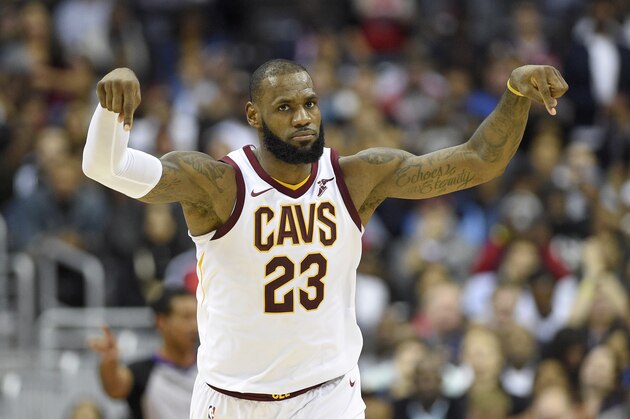 Cleveland Cavaliers forward LeBron James gestures after a  basket during the second half of an NBA basketball game against the Washington Wizards, Friday, Nov. 3, 2017, in Washington. (AP Photo/Nick Wass)