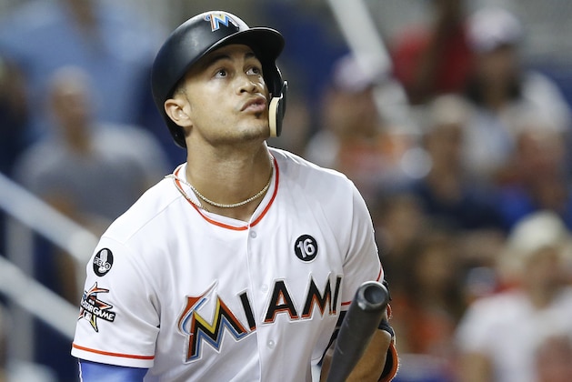 Miami Marlins' Giancarlo Stanton watches the ball as he hits a home run during the fifth inning of a baseball game against the Washington Nationals, Monday, Sept. 4, 2017, in Miami. (AP Photo/Wilfredo Lee)