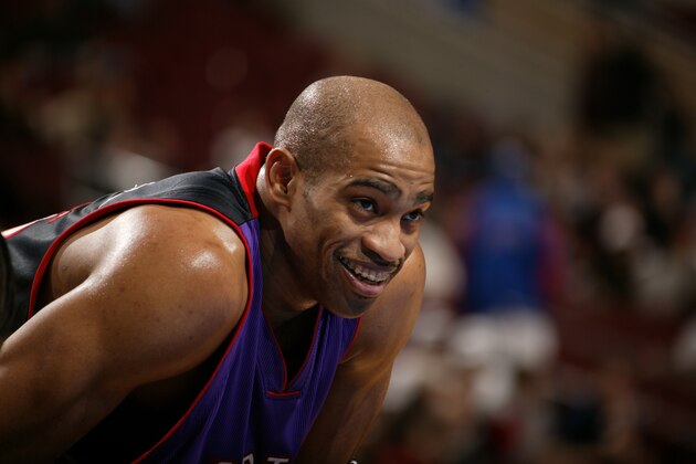 PHILADELPHIA - FEBRUARY 3:  Vince Carter #15 of the Toronto Raptors smiles as he looks on during the game against the Philadelphia 76ers at Wachovia Center on February 3, 2004 in Philadelphia, Pennsylvania.  The Raptors won 93-80.  NOTE TO USER: User expressly acknowledges and agrees that, by downloading and/or using this Photograph, User is consenting to the terms and conditions of the Getty Images License Agreement (Photo by Jesse D. Garrabrant/NBAE via Getty Images)