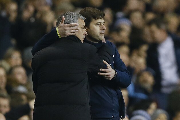 Tottenham manager Mauricio Pochettino, right, embraces Chelsea manager Jose Mourinho at the end of the English Premier League soccer match between Tottenham Hotspur and Chelsea at White Hart Lane Stadium in London, Thursday, Jan. 1, 2015. (AP Photo/Kirsty Wigglesworth)