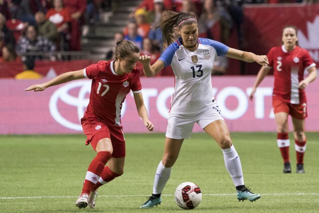 VANCOUVER, BC - NOVEMBER 09: Jessie Fleming #17 of Canada tries to check Alex Morgan #13 of the United States during International Friendly soccer match action at BC Place on November 9, 2017 in Vancouver, Canada. (Photo by Rich Lam/Getty Images)